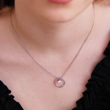 Sterling Silver Circle Pendant with Dangling Cubic Zirconia