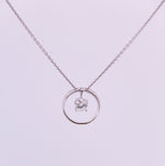 Sterling Silver Circle Pendant with Dangling Cubic Zirconia